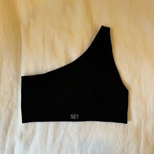 Set Active one shoulder sports bra in black. Size medium.